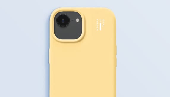 Foto van een geel telefoonhoesje, gemaakt van duurzame materialen.