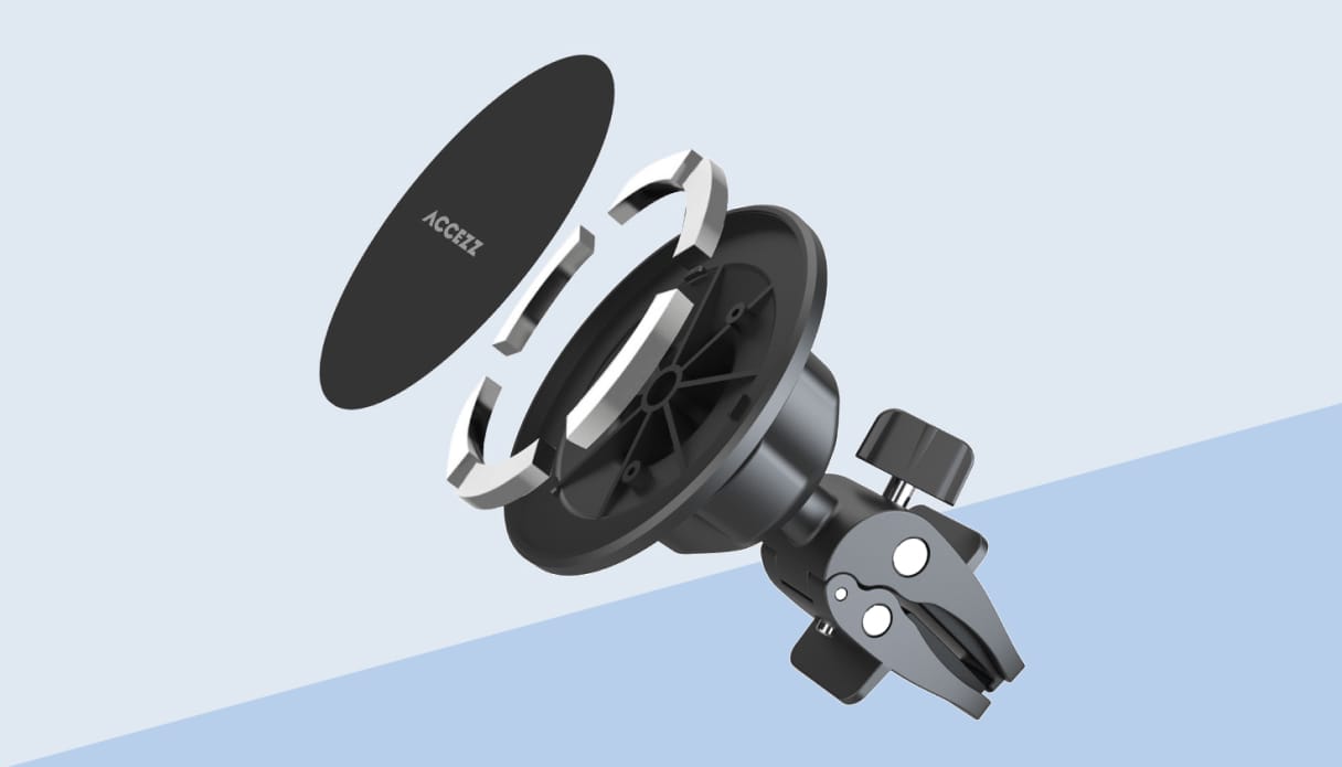 een foto van een magnetische telefoonhouder, uit elkaar gehaald om de werken te verduidelijken