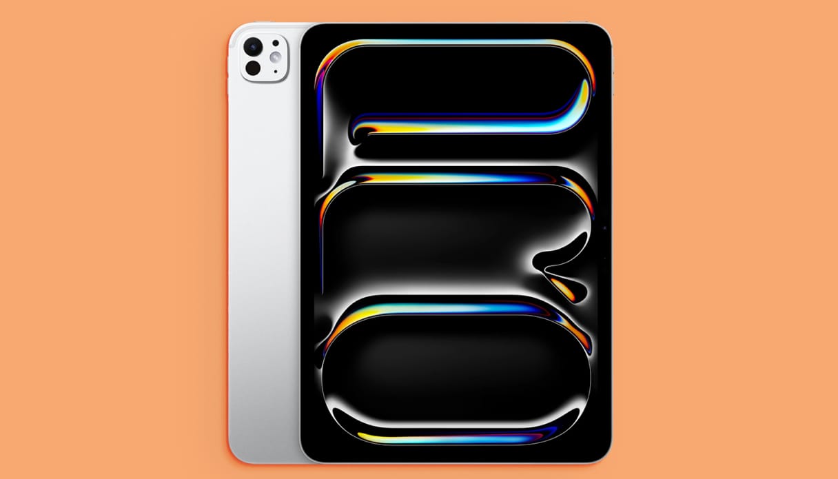 Foto van een iPad pro op een oranje achtergrond.