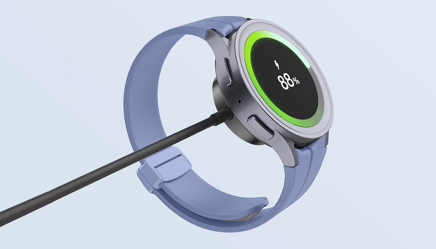 Een Samsung Galaxy Watch aan een zwarte oplader.